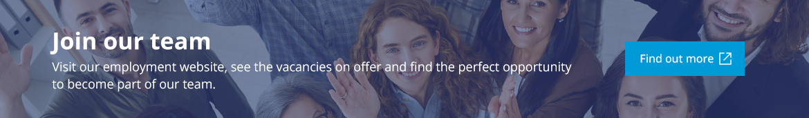 Smiling team looking ahead