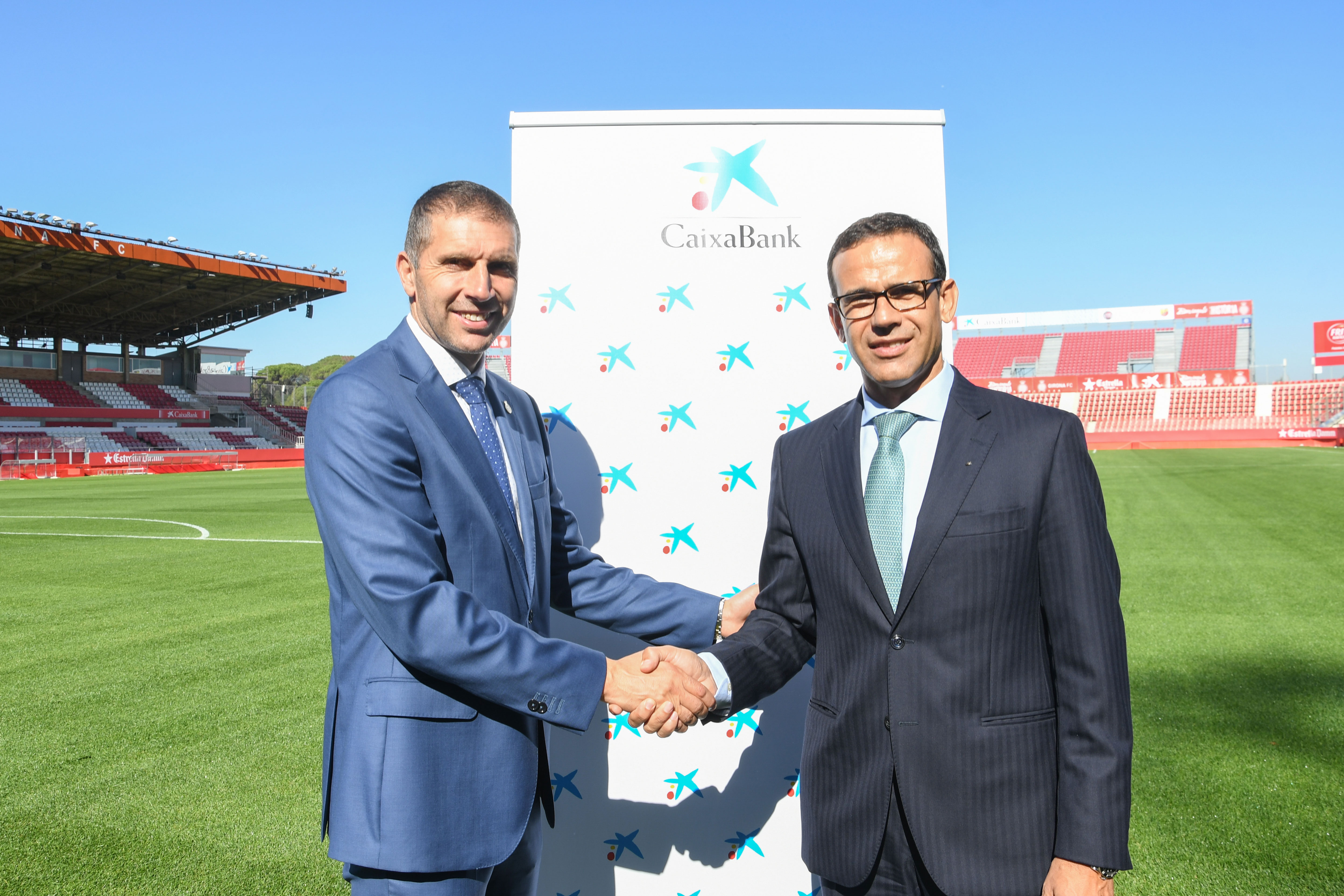 Jaume Masana, director territorial de CaixaBank en Cataluña, y Delfí Geli, presidente del Girona FC.