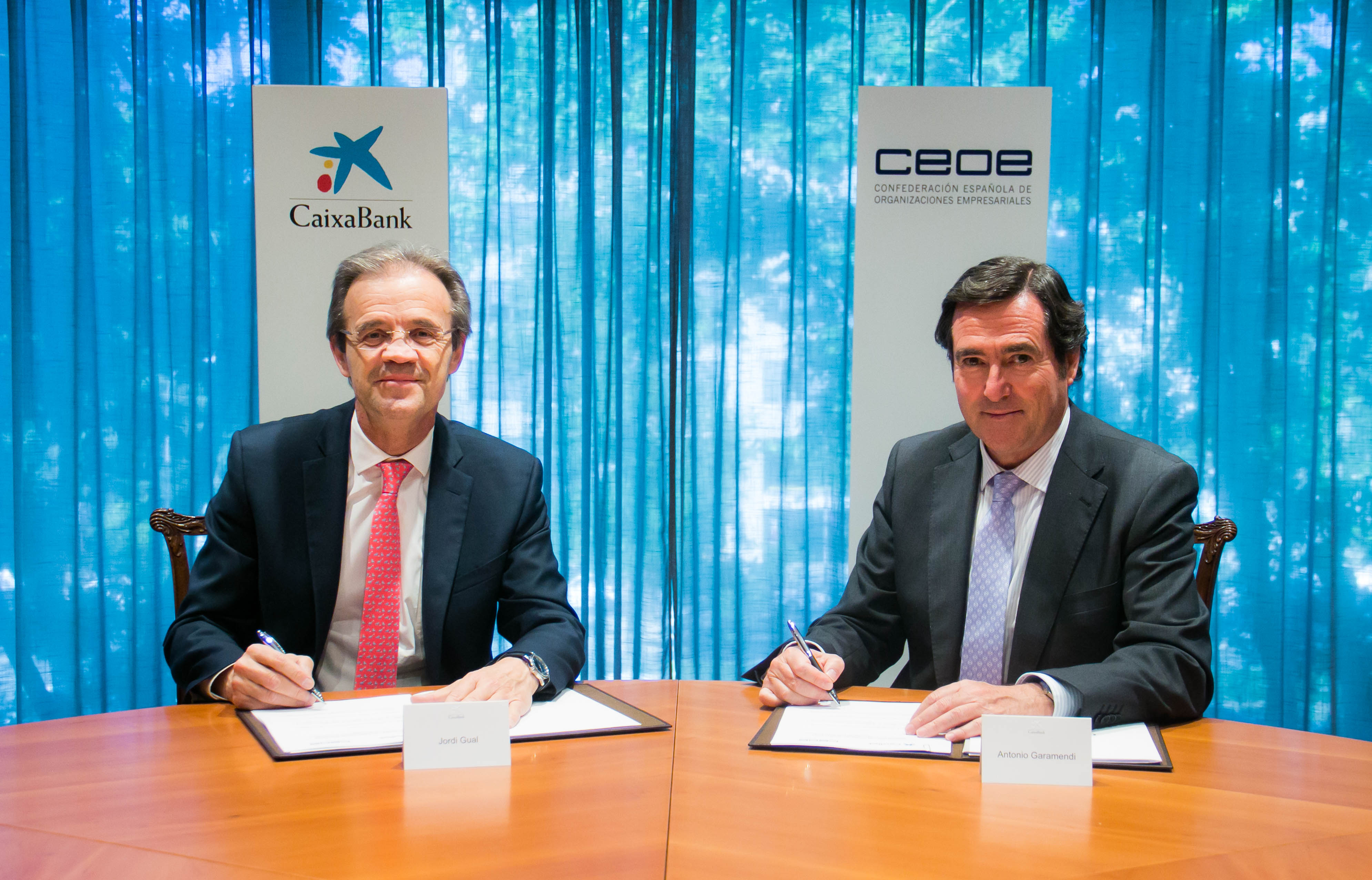 President of CaixaBank, Jordi Gual, and President of the Spanish Confederation of Business Organizations (CEOE), Antonio Garamendi