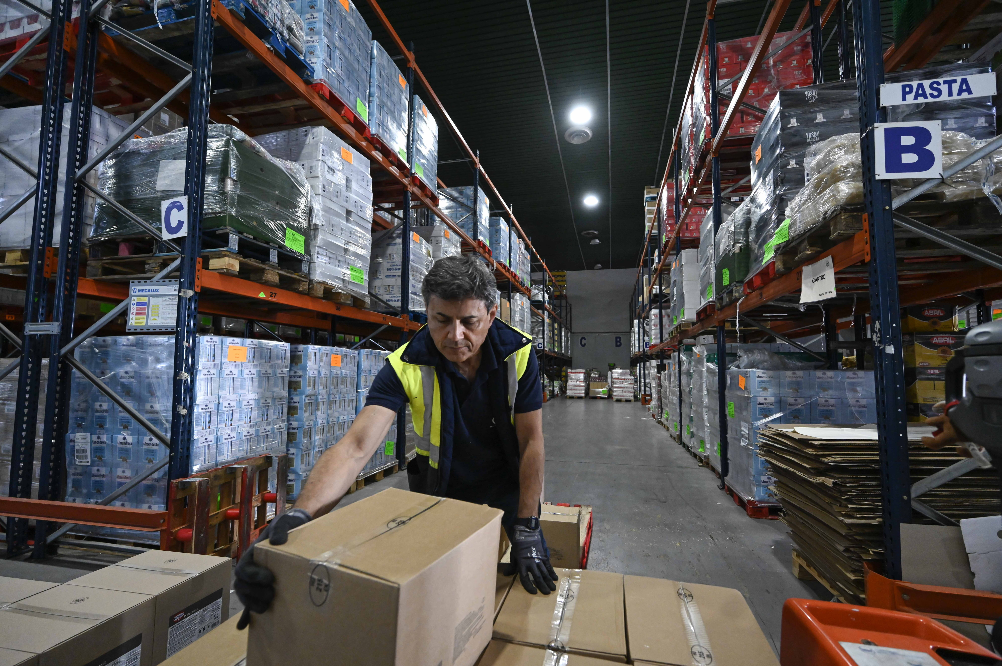 Collecting food at a warehouse for distribution to Food Banks