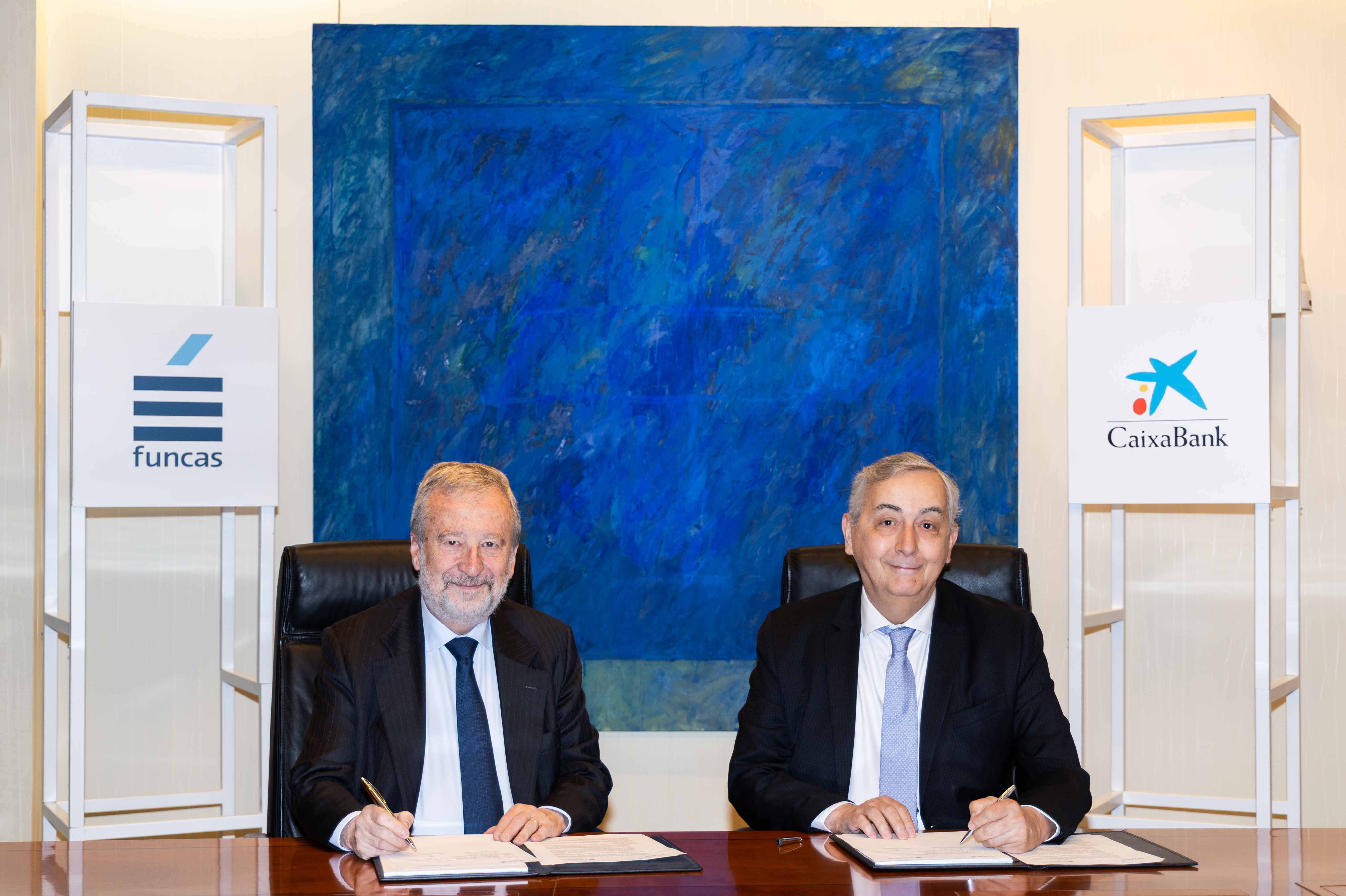 CaixaBank Chairman Tomás Muniesa and Funcas Director General Carlos Ocaña during the signing of the collaboration agreement on financial education.