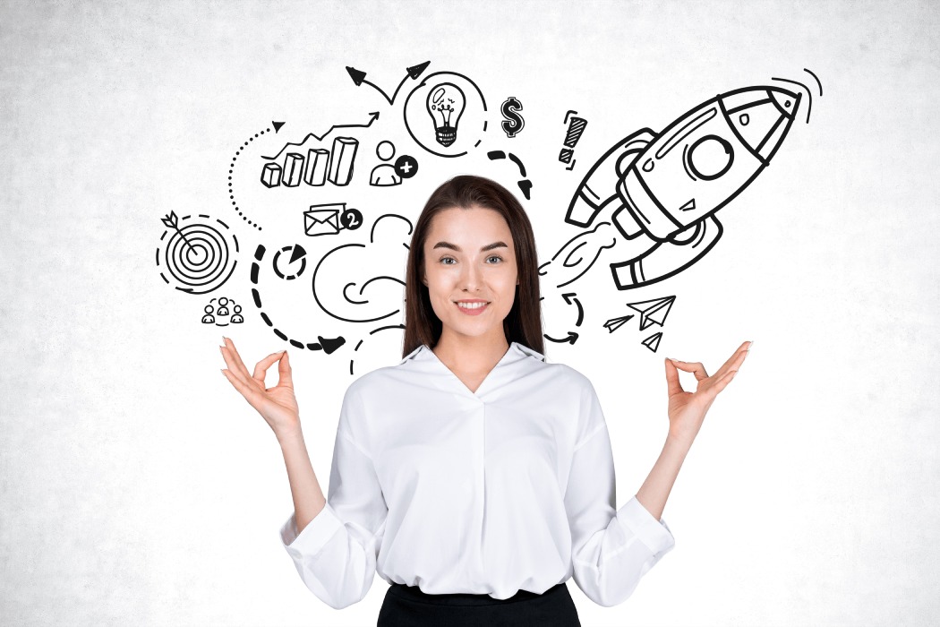 Emprendedora rodeada de ideas con las manos preparadas para meditar
